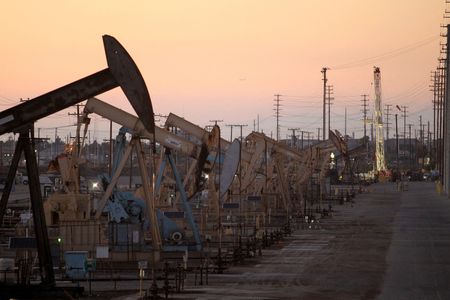 Oil settles lower, demand worries offset geopolitical price support